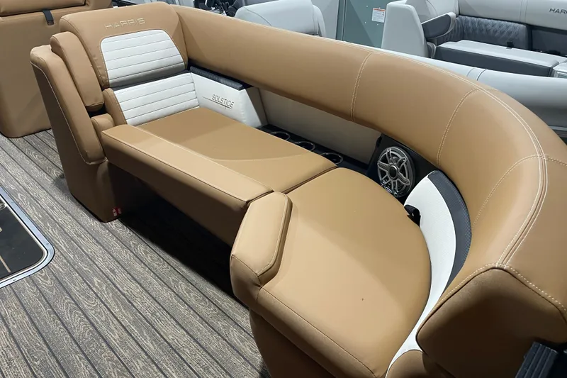 Slide: The Image of Luxurious seating on 2026 Harris Solstice 230 boat, featuring tan and white upholstery. - 6