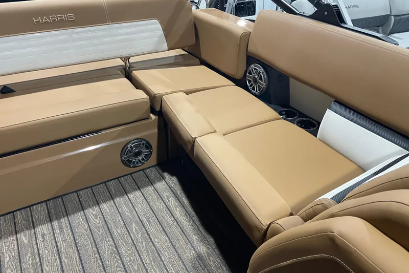 Slide: The Image of Luxurious seating on 2026 Harris Solstice 230 boat with tan upholstery and integrated speakers. - 8