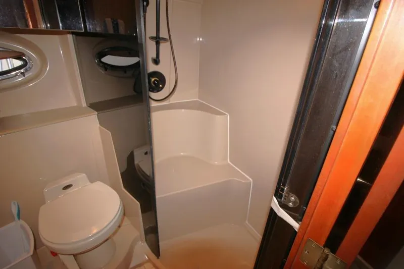 Slide: The Image of Bathroom interior of 2000 Cruisers Yachts 3672 Express with shower and toilet. - 18