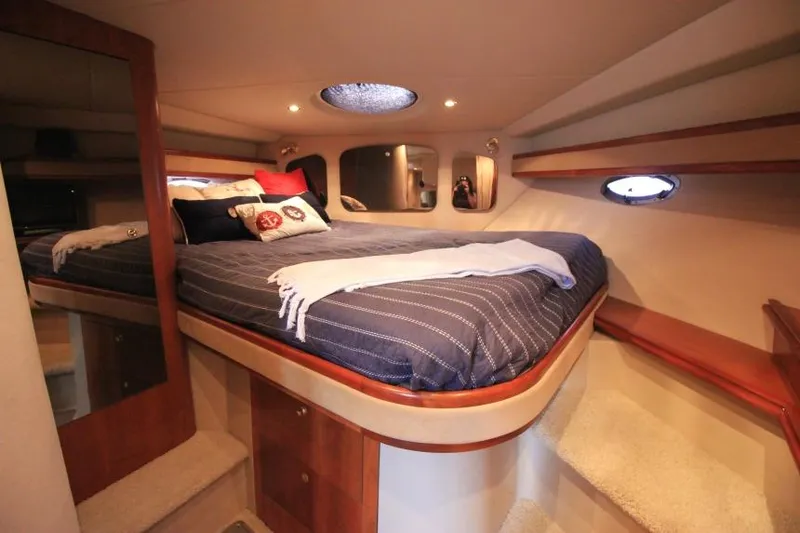 Slide: The Image of Luxurious cabin interior of 2000 Cruisers Yachts 3672 Express with cozy bedding. - 19