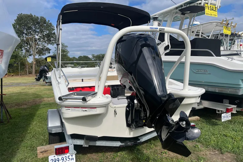 Slide: The Image of 2024 Boston Whaler 160 Super Sport boat with outboard motor, displayed for sale. - 13