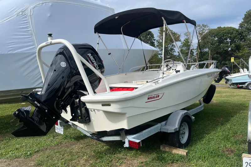 Slide: The Image of 2024 Boston Whaler 160 Super Sport boat on trailer with Mercury outboard engine. - 16