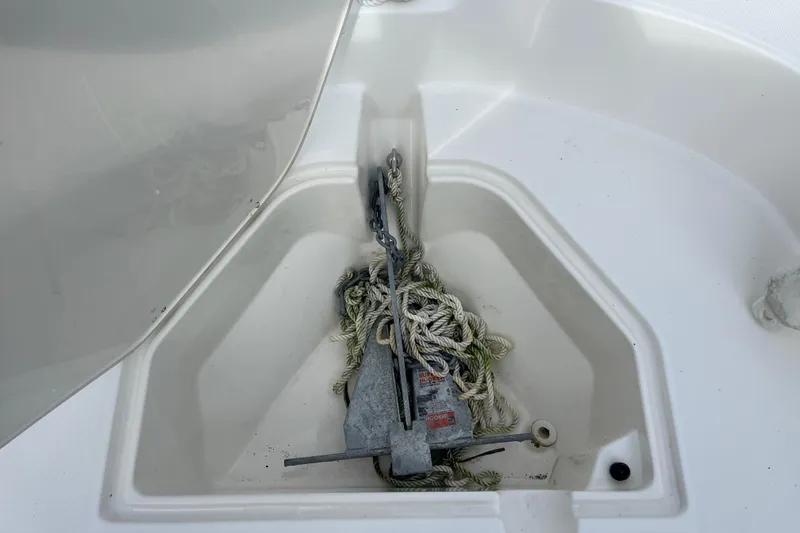 Slide: The Image of Anchor storage compartment on 2024 Boston Whaler 160 Super Sport boat. - 6