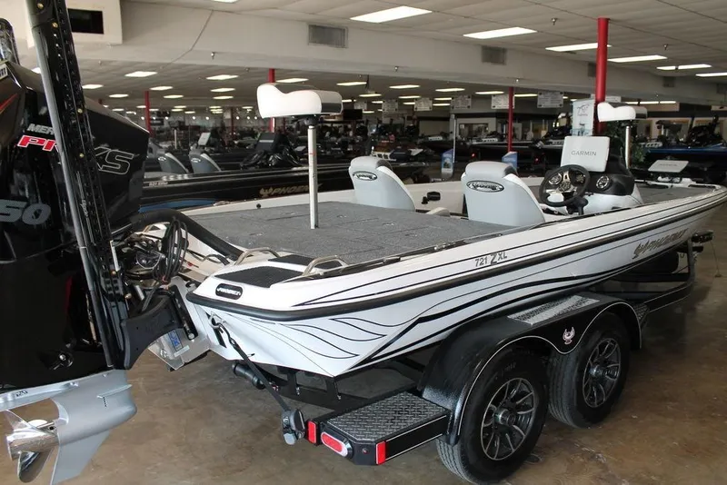 Slide: The Image of 2026 Phoenix 721 ZXL boat in showroom, featuring dual seats and advanced equipment. - 3