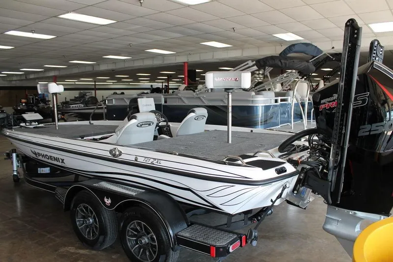 Slide: The Image of 2026 Phoenix 721 ZXL boat in showroom, featuring sleek design and powerful engine. - 4