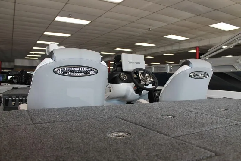 Slide: The Image of 2026 Phoenix 721 ZXL boat interior with Garmin navigation system and plush seating. - 5