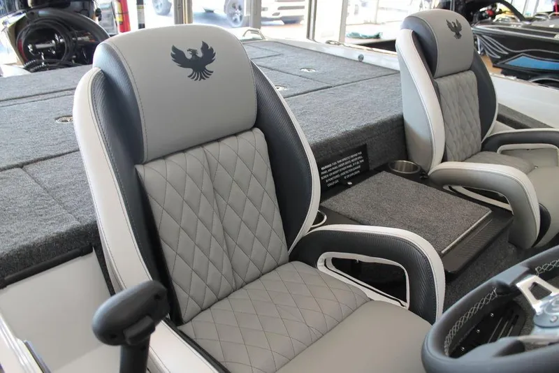 Slide: The Image of 2026 Phoenix 721 ZXL boat interior with luxurious quilted seats and sleek design. - 6