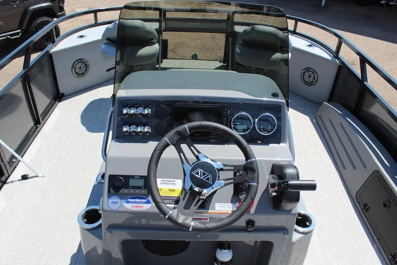 Slide: The Image of 2026 Avalon Venture 85 Center Console Fish boat interior with steering wheel and controls. - 16
