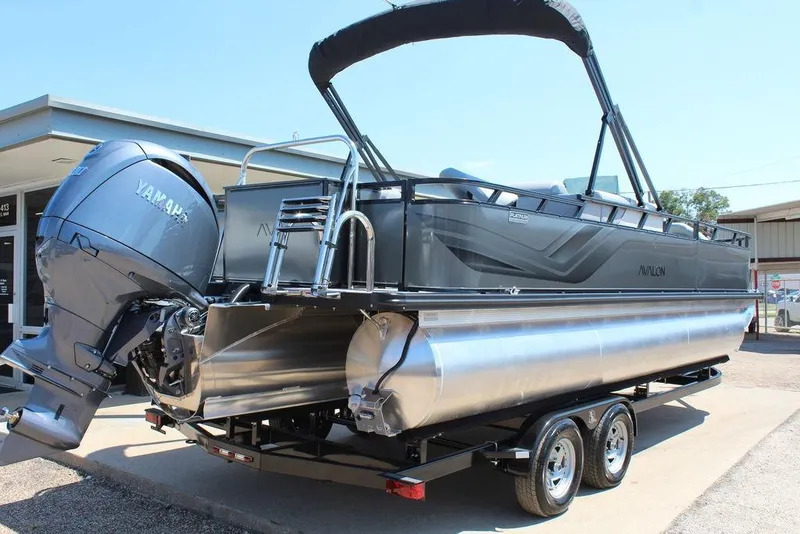 Slide: The Image of 2026 Avalon Venture 85 Center Console Fish boat on trailer, featuring Yamaha outboard motor. - 3