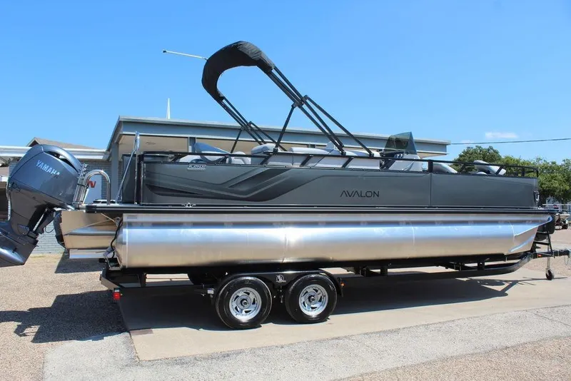 Slide: The Image of 2026 Avalon Venture 85 Center Console Fish 23 FT boat on trailer, side view. - 5