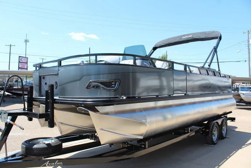 Slide: The Image of 2026 Avalon Venture 85 Center Console Fish 23 FT boat on trailer, sleek design. - 6