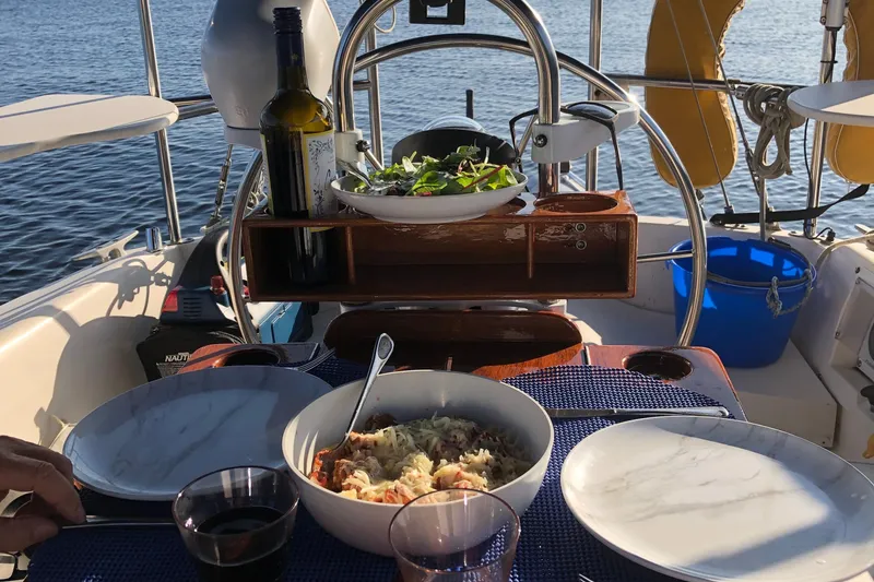 Slide: The Image of Dinner setup on a 1989 Catalina 30 MkII sailboat with wine and salad. - 10