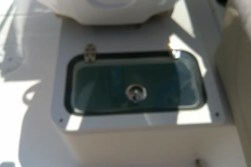 Slide: The Image of 2015 Pursuit DC 235 Dual Console boat livewell, top view. - 27