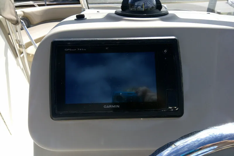 Slide: The Image of Garmin GPSMAP 741xs on 2015 Pursuit DC 235 Dual Console boat dashboard. - 33