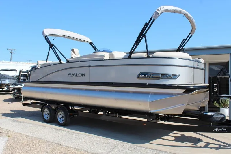 Slide: The Image of 2026 Avalon Catalina Quad Lounger Shift 25 FT pontoon boat on trailer. - 1