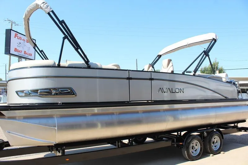 Slide: The Image of 2026 Avalon Catalina Quad Lounger Shift 25 FT pontoon boat on trailer. - 2