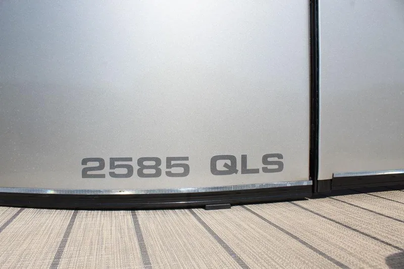 Slide: The Image of 2026 Avalon Catalina Quad Lounger Shift 25 FT, model number 2585 QLS, silver exterior. - 23