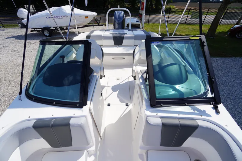 Slide: The Image of 2026 Chaparral 21 SSi OB boat interior with open windshield and seating. - 10