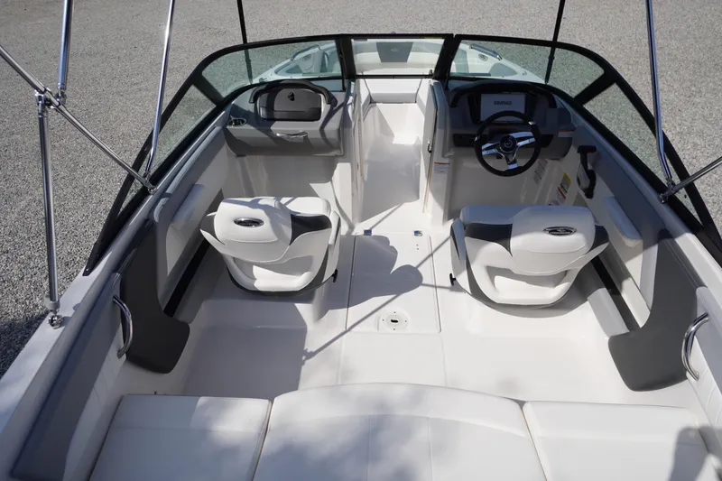 Slide: The Image of 2026 Chaparral 21 SSi OB boat interior with dual seating and steering console. - 11