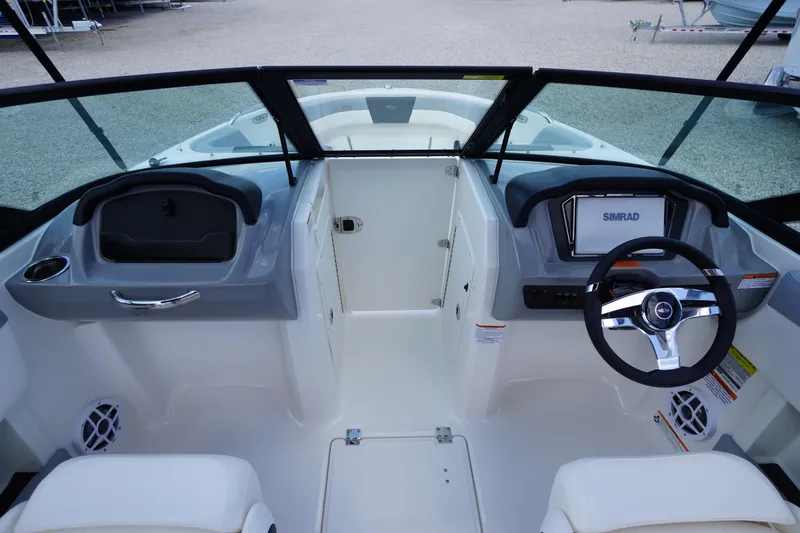 Slide: The Image of 2026 Chaparral 21 SSi OB boat interior with steering wheel and dashboard display. - 12