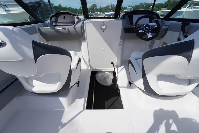 Slide: The Image of Interior of 2026 Chaparral 21 SSi OB boat with modern seating and steering wheel. - 13