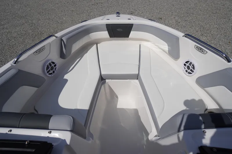 Slide: The Image of 2026 Chaparral 21 SSi OB boat interior with white seating and speaker system. - 3