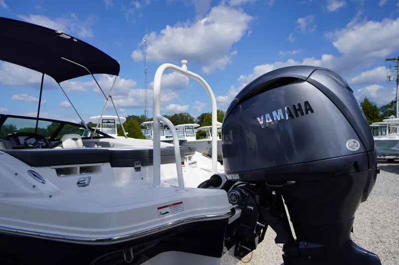 Slide: The Image of 2026 Chaparral 21 SSi OB boat with Yamaha outboard motor under blue sky. - 40