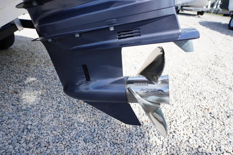 Slide: The Image of Outboard motor propeller of 2026 Chaparral 21 SSi OB on gravel surface. - 42