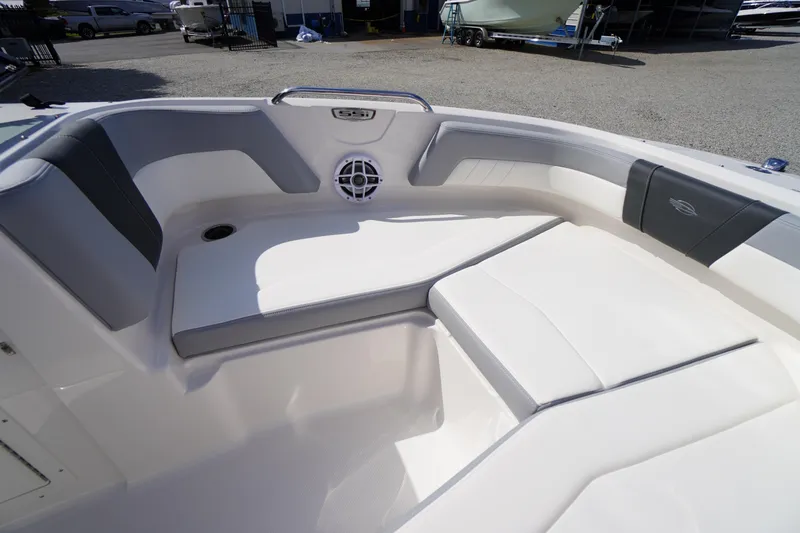 Slide: The Image of 2026 Chaparral 21 SSi OB boat interior with white and gray seating. - 6