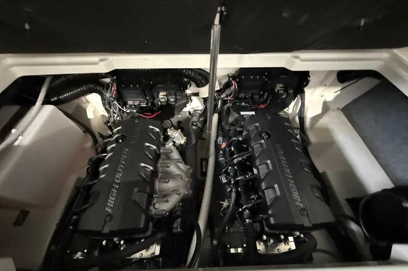 Slide: The Image of 2023 Yamaha Boats 252SD engine compartment with dual high-output engines. - 14