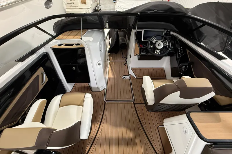 Slide: The Image of 2023 Yamaha Boats 252SD interior with sleek design, modern dashboard, and comfortable seating. - 22