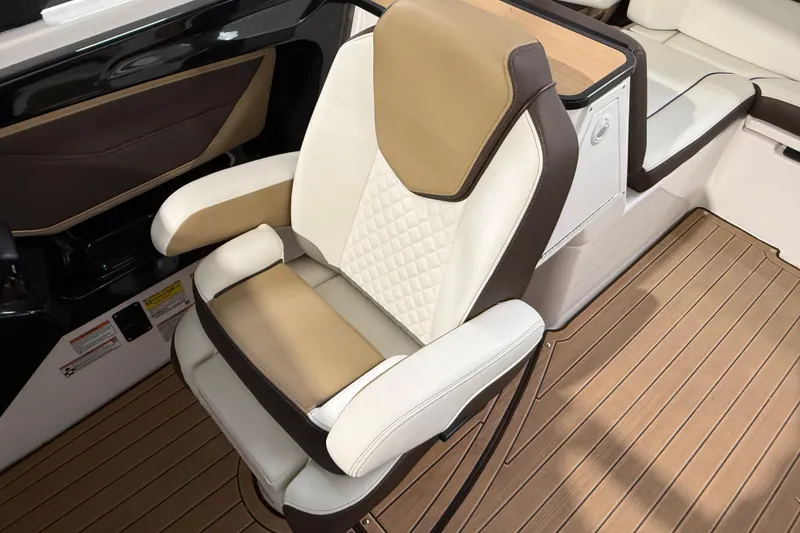 Slide: The Image of Luxurious seating on 2023 Yamaha Boats 252SD, featuring elegant tan and white upholstery. - 27