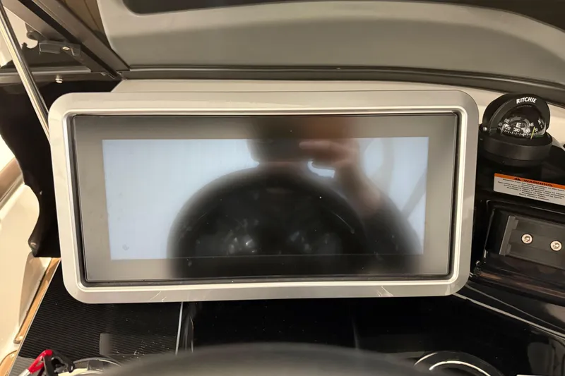 Slide: The Image of Dashboard of 2023 Yamaha Boats 252SD with touchscreen and compass. - 31
