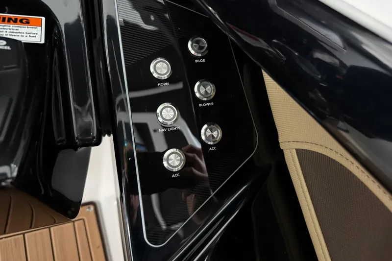 Slide: The Image of Control panel of 2023 Yamaha Boats 252SD with labeled buttons for various functions. - 33