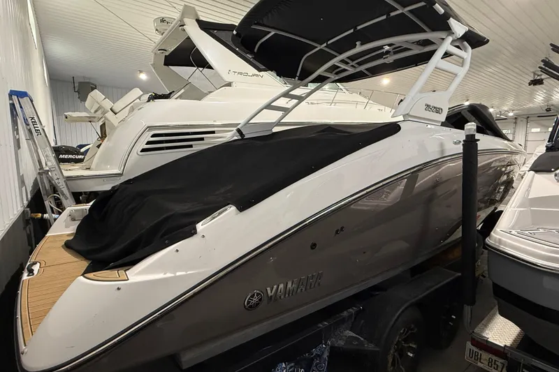 Slide: The Image of 2023 Yamaha Boats 252SD in storage, covered and parked indoors. - 8