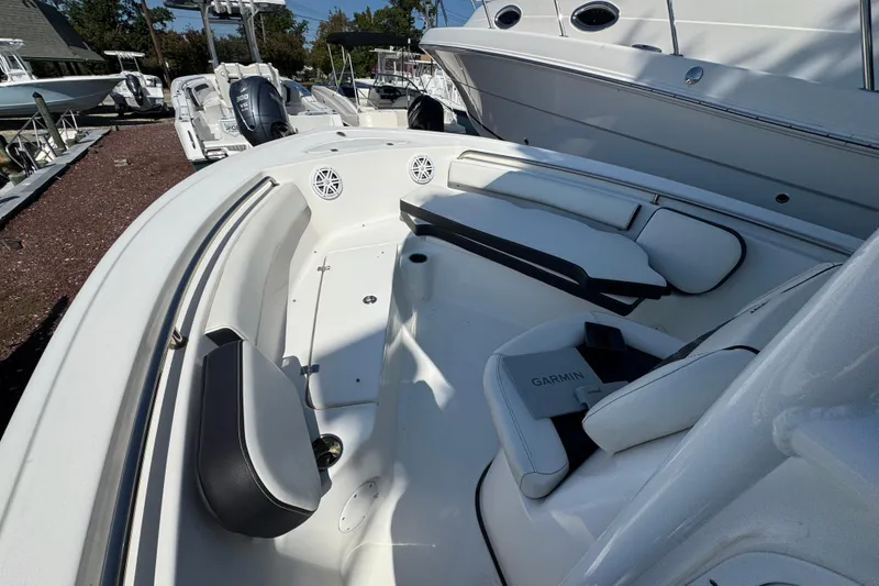 Slide: The Image of 2021 Tidewater 210 CC Adventure boat interior with seating and Garmin equipment. - 10
