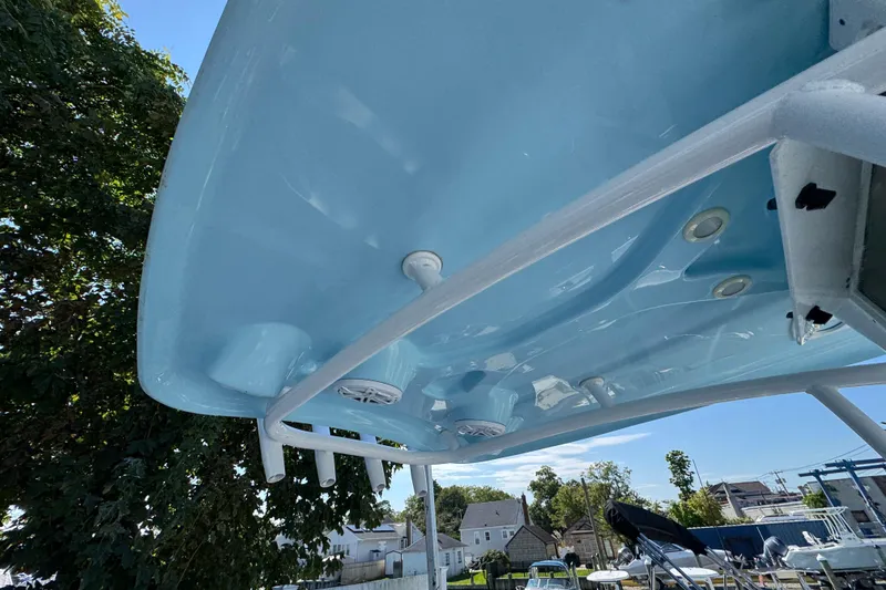 Slide: The Image of 2021 Tidewater 210 CC Adventure boat's underside view with speakers and lights. - 14