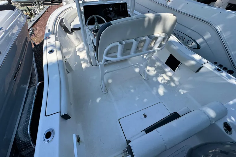 Slide: The Image of 2021 Tidewater 210 CC Adventure boat interior with seating and steering console. - 19