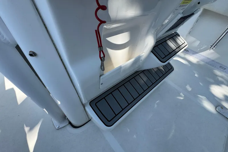 Slide: The Image of 2021 Tidewater 210 CC Adventure boat interior with non-slip steps and safety features. - 20