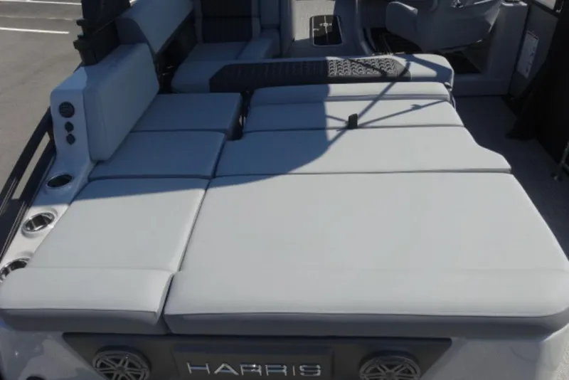 Slide: The Image of Luxury seating on 2026 Harris Solstice 250 pontoon boat, featuring spacious cushioned layout. - 11