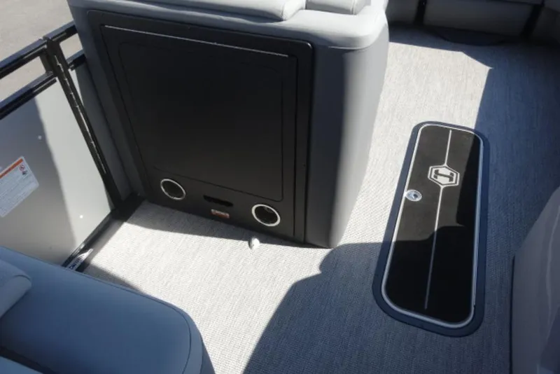 Slide: The Image of 2026 Harris Solstice 250 boat interior with sleek seating and storage compartment. - 12