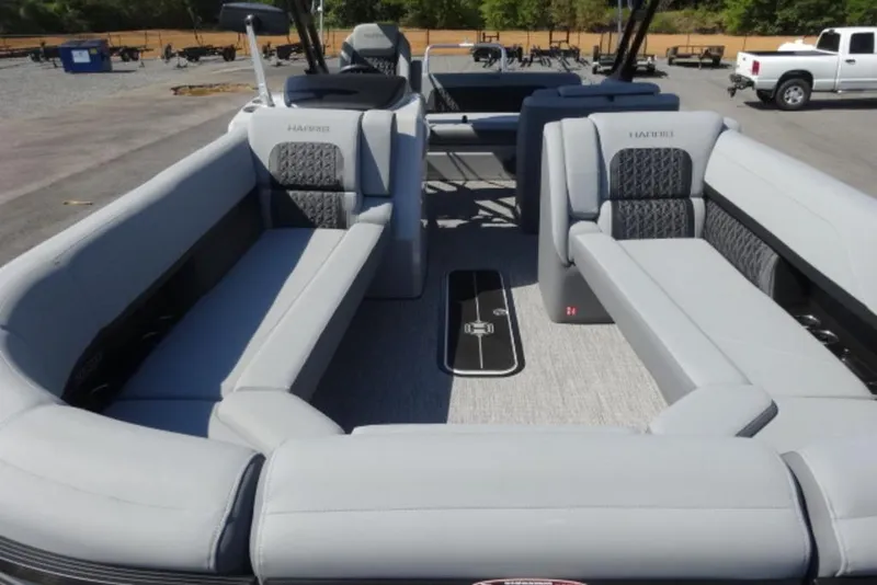 Slide: The Image of 2026 Harris Solstice 250 pontoon boat with spacious seating and modern design. - 5