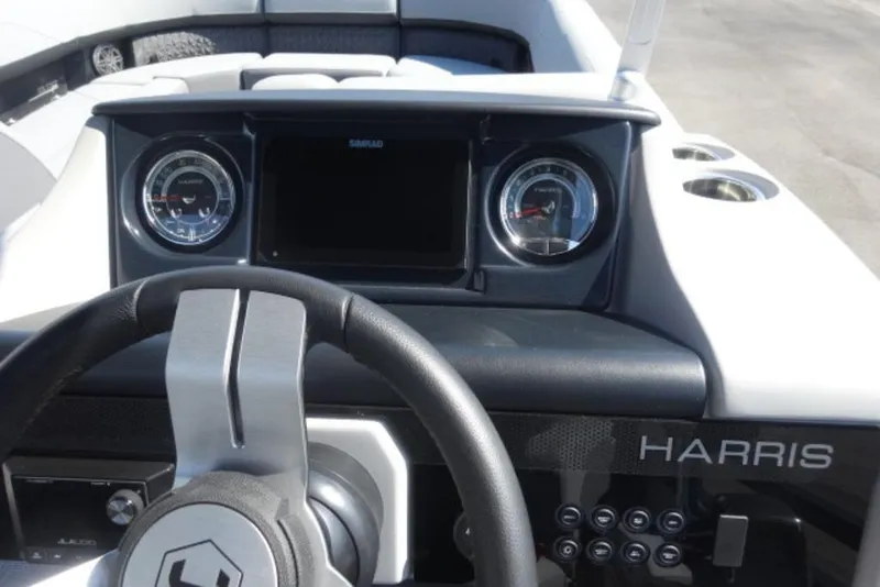 Slide: The Image of 2026 Harris Solstice 250 dashboard with steering wheel and gauges, featuring modern design elements. - 9