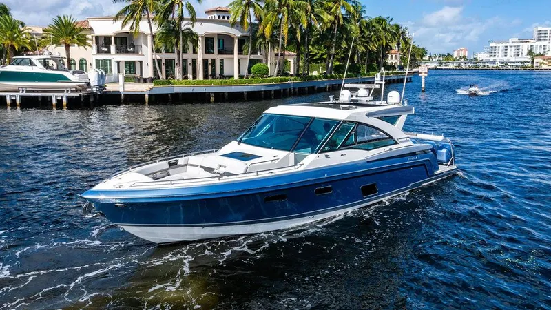Slide: The Image of 2019 Formula 430 All Sport Crossover yacht cruising near waterfront homes. - 21