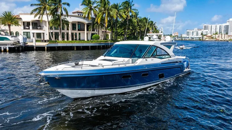 Slide: The Image of 2019 Formula 430 All Sport Crossover boat cruising near waterfront homes. - 22