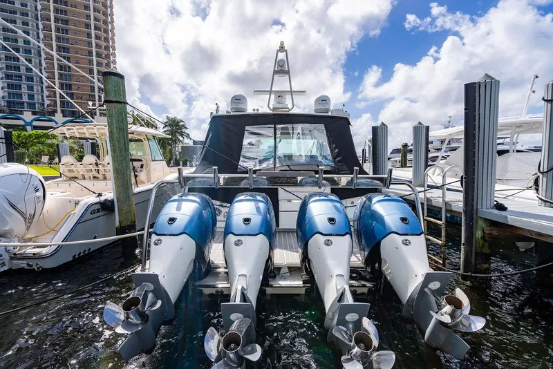 Slide: The Image of 2019 Formula 430 All Sport Crossover with four powerful outboard engines docked at marina. - 25