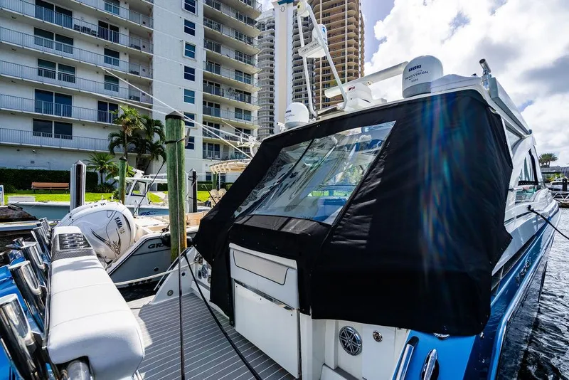 Slide: The Image of 2019 Formula 430 All Sport Crossover yacht docked near waterfront buildings. - 27