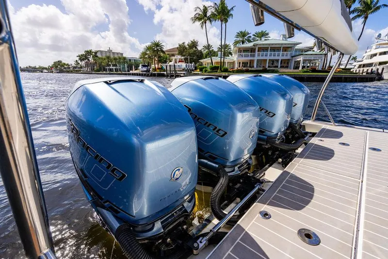 Slide: The Image of Four blue outboard motors on a 2019 Formula 430 All Sport Crossover boat. - 49