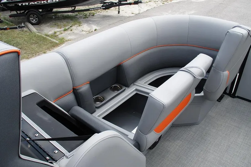 Slide: The Image of 2026 Bentley Pontoons 223 Bolt interior seating with gray upholstery and orange accents. - 11