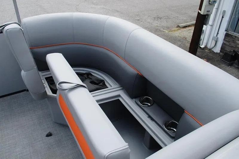 Slide: The Image of 2026 Bentley Pontoons 223 Bolt interior with gray seating and orange accents. - 16